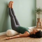 Vagus nerve yoga exercises — woman in legs-up-the-wall pose for calm